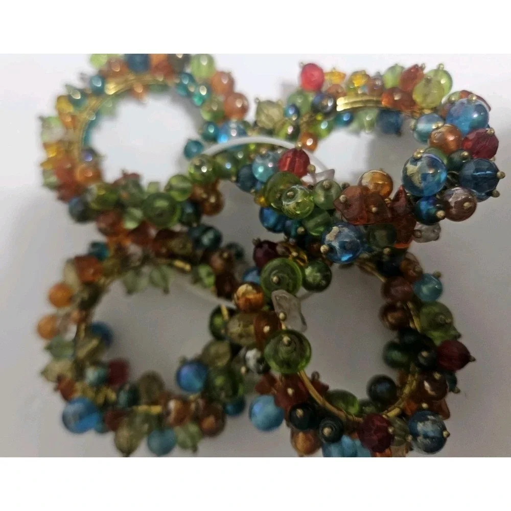 Set Of Four Vintage Pier One Multicolored Napkin Holder Or Drapery Holdback